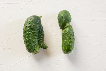 Ugly two cucumber. Concept organic vegetables. Close up.