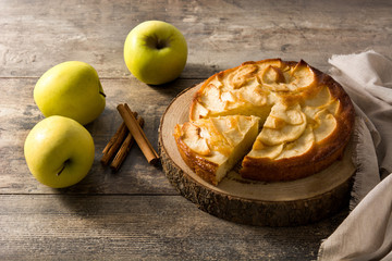 Homemade apple pie on wooden table. 