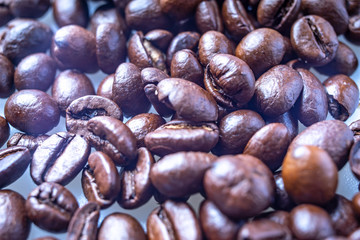Fototapeta premium Coffee Beans Background. Close Up fresh roasted brown
