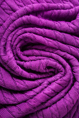 Fototapeta na wymiar Background made of knitted ornament texture. Macro photo.