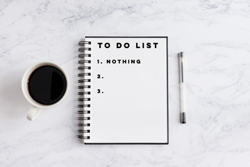 To do list nothing writing on notebook. Notebook on desk with coffee cup and a pen. - obrazy, fototapety, plakaty