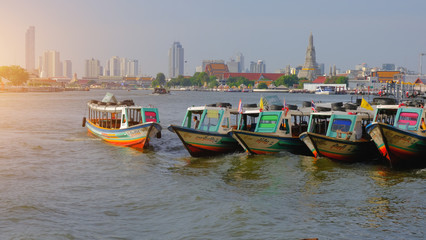 Fototapeta na wymiar Colorful Passenger Boats at Chao Phraya River, bangkok thailand.