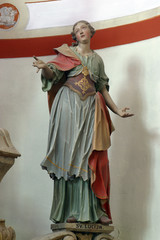 Fototapeta na wymiar Saint Lucia, statue on the main altar in the church of Saint Barbara in the Bedkovcina, Croatia