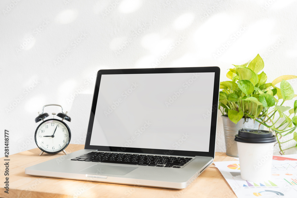 Sticker computer laptop blank screen for mockup creative design technology template on wood table.