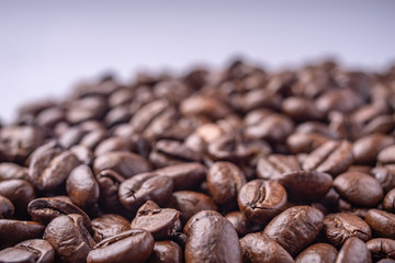 Coffee Beans Background. Close Up fresh roasted brown