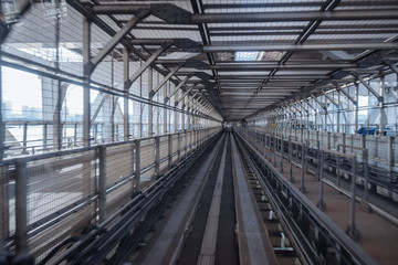 tunnel of monorail road view from front window of a moving train running