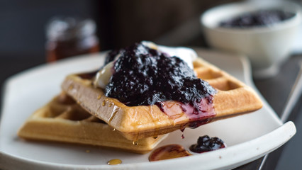 Close up of Waffle with blueberry Jam and Whipped Cream