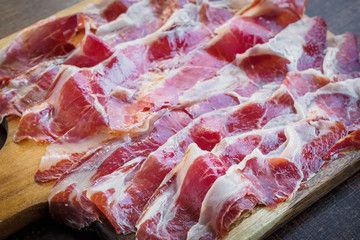 Iberico ham cut on a wooden board