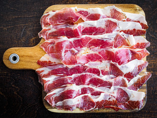 Iberico ham cut on a wooden board