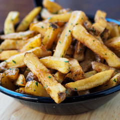 french fries potatoes on a black pan