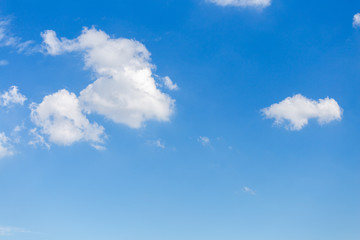 White clouds with blue sky background.