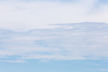 White clouds with blue sky background.