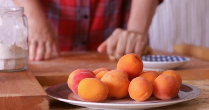 Apricot frangipane tart preparing, kneading cake dough,  steadicam, close-up