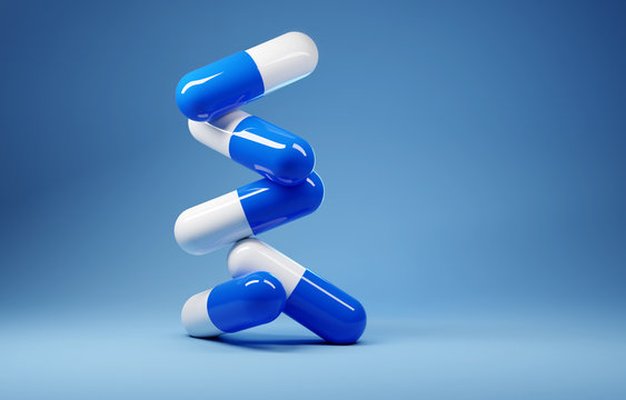 A stack of antibiotic pill capsules on a blue background. 3D render illustration.