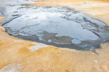 Hverir Namafjall colorful geothermal place in Iceland. Fumaroles volcanic boiling mud pots,...
