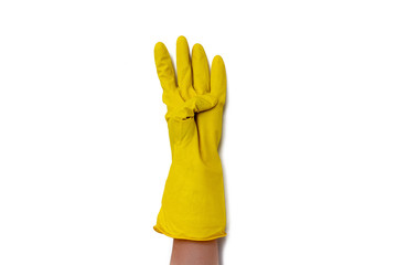 Hand with yellow cleaning gloves showing symbolic gestures. hand in a yellow protective glove counts up to four