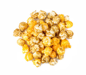 a pile of caramel corn on a white background