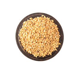 Golden flax seeds on a white background