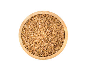 Golden flax seeds in wooden bowl isolated on white background