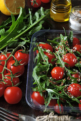 Healthy salad arugula cherry lunch box. Dietary salad to go.