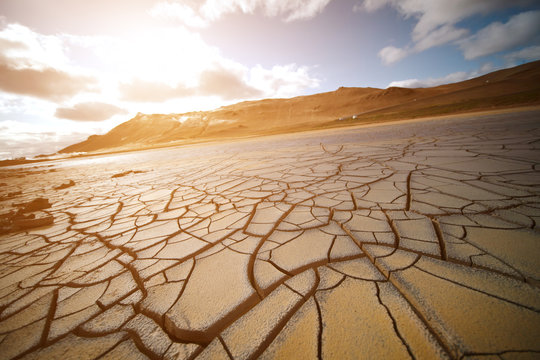 Dried land in the desert. Cracked soil crust © luchschenF