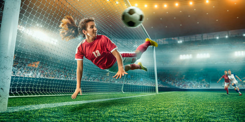 Female Soccer player in action on a professional soccer stadium. Girl playing soccer