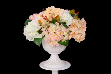 beautiful flowers made of beige fabric on black background
