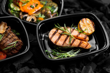 Coal cooked healthy food in take away boxes for daily nutrition