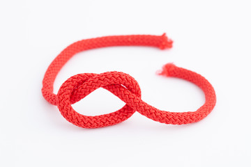 Cord knot on white background