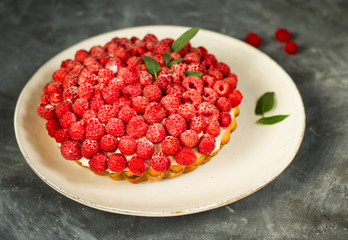 Raspberry cake on gray background