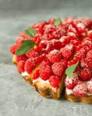 Raspberry cake on gray background