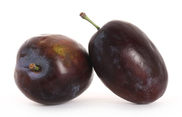 Fresh plums isolated on white background