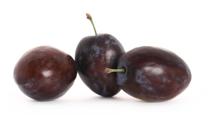 Fresh plums isolated on white background