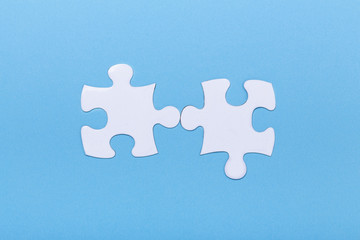 CCloseup of jigsaw puzzle on blue background Missing jigsaw puzzle piece, business concept for completing the piece Teamwork concept