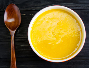 Pumpkin soup served on the table in bowl