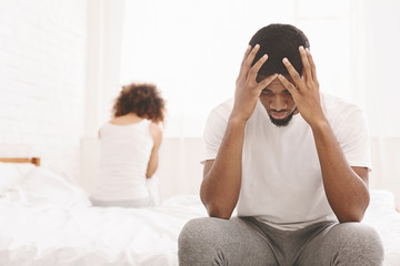 Young couple in bed having problems and crisis