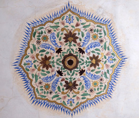 Beautiful ornament on wall of palace in Amber Fort in Jaipur, Rajasthan, India