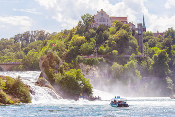 Fototapeta premium Sightseeing Boats crossing the Rhine at the Rhinefall 