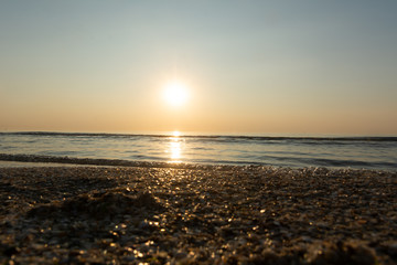 Sea wave in the morning light of the sunrise