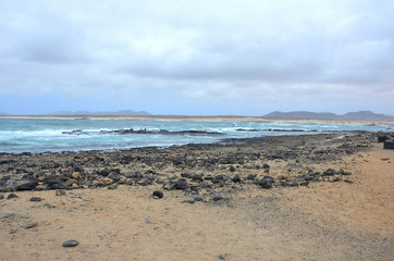 Fototapeta na wymiar Rocky Volcanic Beach on the Northwest of Fuerteventura, Canary Islands