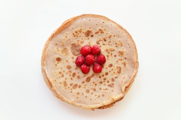 Pancakes on a white background. Raspberries with pancakes on a white isolated background.
