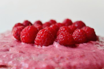raspberries on a plate. Cake, dessert raspberry  on a white background isolated. A pancake cake. Raspberry cream. 