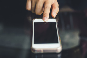 hipster woman using hands touching and typing on mobile phone screen search internet online working or social communication with digital technology app device in coffee shop indoor vintage lifestyle.