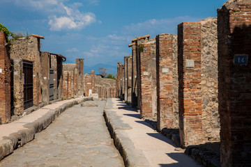 The streets of Pompeii made of large blocks of black volcanic rocks