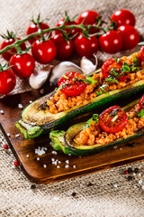 Stuffed zucchini with groats and vegetables
