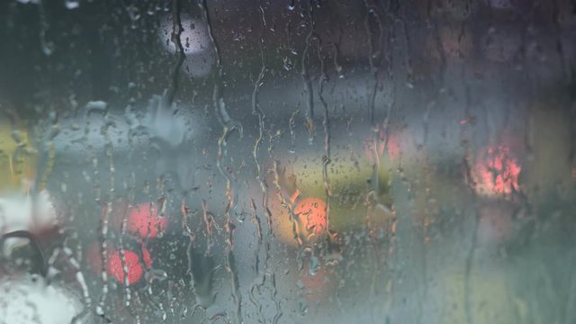 Stock video  Raindrops on the window glass. Soft focus