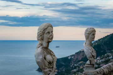 Fototapeta na wymiar Statues from the belvedere, the so-called Terrazza dell'infinito, The Terrace of Infinity seen on the sunset, Villa Cimbrone, Ravello village, Amalfi coast of Italy