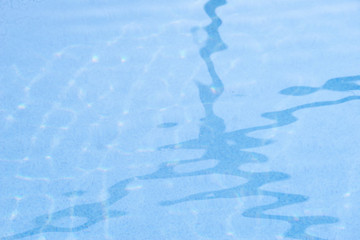Obraz na płótnie Canvas Lines reflected in the water of a pool