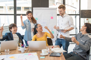 Successful casual business teamwork celebrating at the office,Creative concept.
