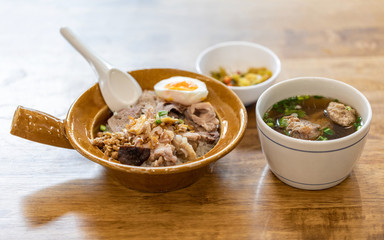 Thai meal, cooked rice with boiled egg and pork ribs soup